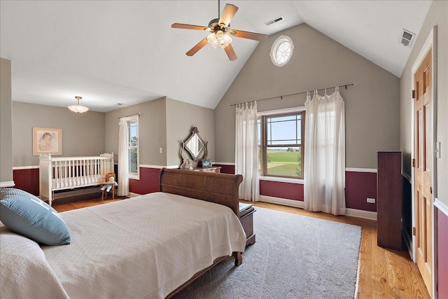 27425 S Steven Ray Dr, Monee, IL 60449 - bedroom with light wood-style flooring, multiple windows, high vaulted ceiling, and ceiling fan