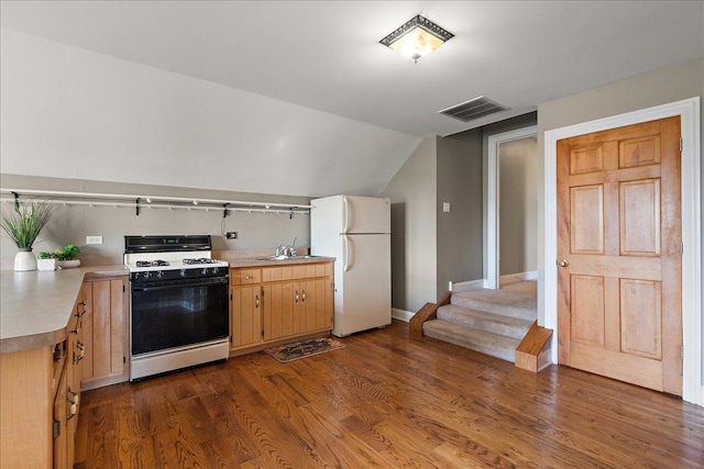27425 S Steven Ray Dr, Monee, IL 60449 - kitchen with white appliances, light countertops, dark wood finished floors, and vaulted ceiling