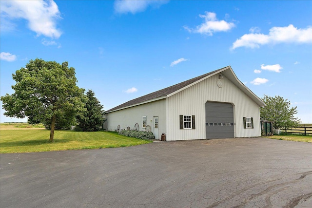 27425 S Steven Ray Dr, Monee, IL 60449 - view of side of home with a detached garage, an outbuilding, and roof with shingles