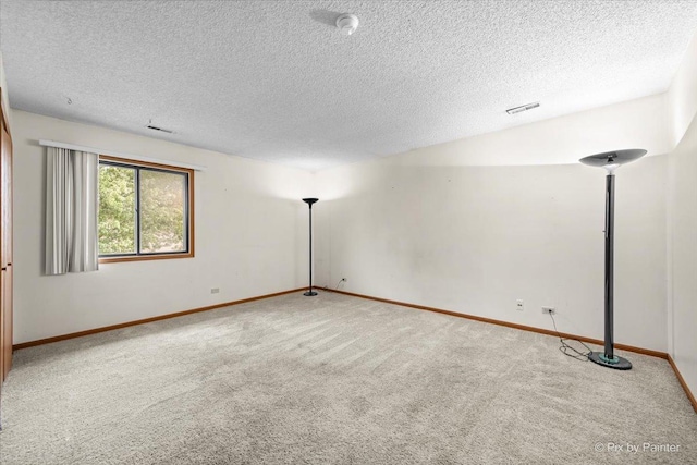 11405 Douglas Ave Unit D, Huntley, IL 60142 - carpeted empty room with a textured ceiling and baseboards