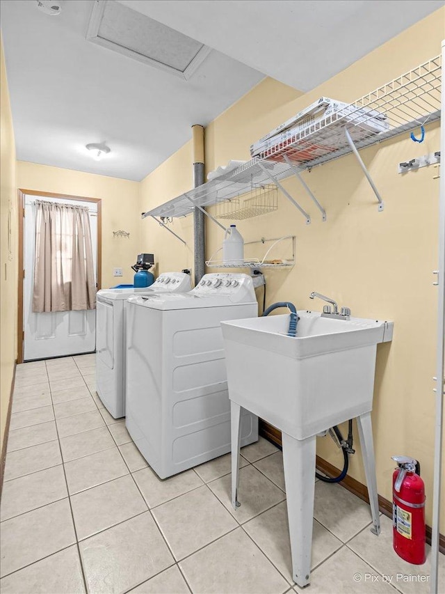 11405 Douglas Ave Unit D, Huntley, IL 60142 - laundry area with independent washer and dryer, light tile patterned floors, and attic access
