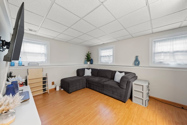 1191 Narragansett Dr, Carol Stream, IL 60188 - living room featuring wood finished floors, a drop ceiling, and baseboards