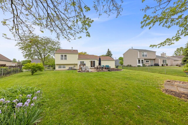1191 Narragansett Dr, Carol Stream, IL 60188 - back of house with a patio, an outdoor living space, and central AC