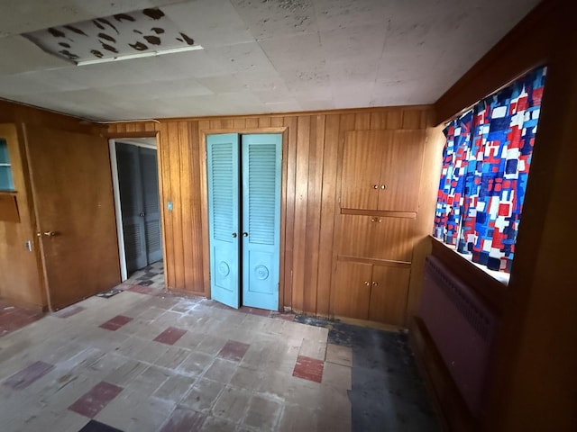 1850 Garland Ave, Highland Park, IL 60035 - spare room with tile patterned floors and wooden walls