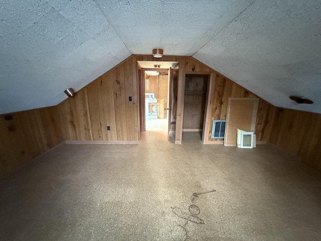 1850 Garland Ave, Highland Park, IL 60035 - bonus room with wooden walls, a textured ceiling, vaulted ceiling, and heating unit
