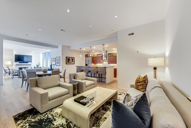 500 W Superior St Unit 612, Chicago, IL 60654 - living room with light wood-style floors and recessed lighting