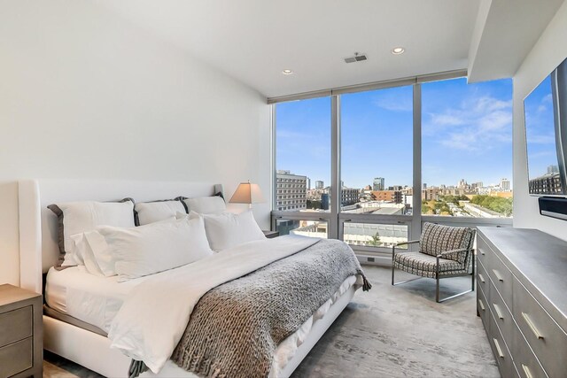 500 W Superior St Unit 612, Chicago, IL 60654 - carpeted bedroom featuring a wall of windows, multiple windows, and recessed lighting