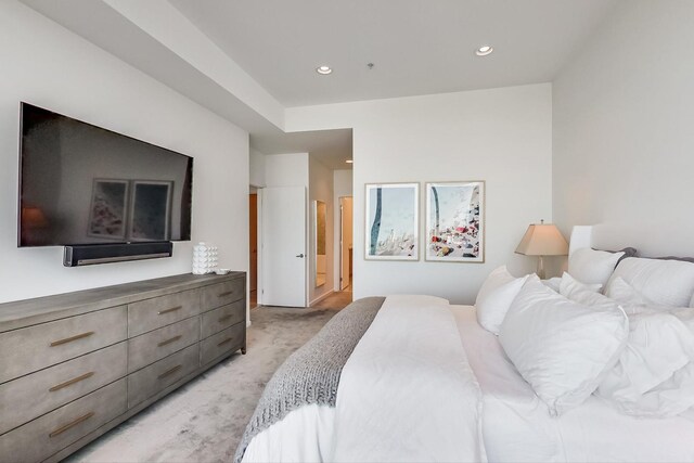 500 W Superior St Unit 612, Chicago, IL 60654 - bedroom with light carpet, recessed lighting, and ensuite bath