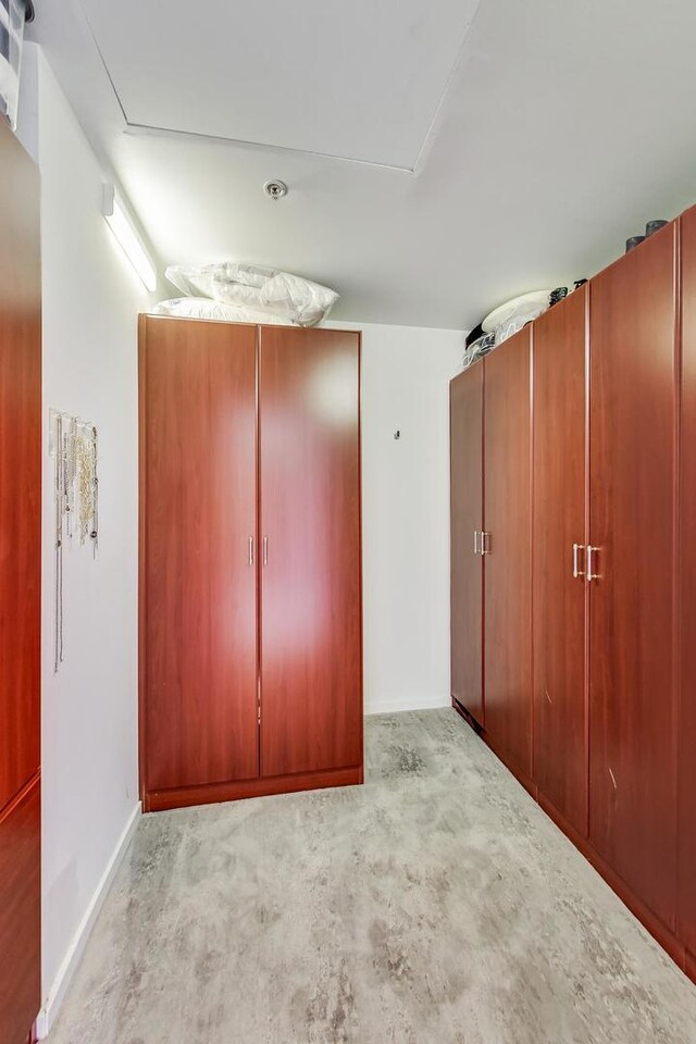 500 W Superior St Unit 612, Chicago, IL 60654 - unfurnished bedroom with baseboards and a closet