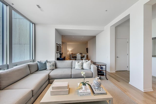 500 W Superior St Unit 612, Chicago, IL 60654 - living room featuring light wood-type flooring and baseboards