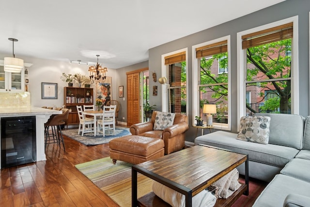 1012 S Loomis St Unit F, Chicago, IL 60607 - living area with beverage cooler, dark wood-type flooring, and a chandelier
