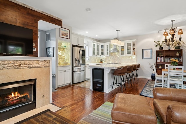 1012 S Loomis St Unit F, Chicago, IL 60607 - living area featuring dark wood-style flooring, recessed lighting, a high end fireplace, and baseboards