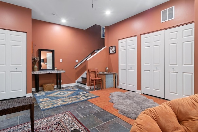 1012 S Loomis St Unit F, Chicago, IL 60607 - entryway with stairs, baseboards, recessed lighting, and stone finish flooring