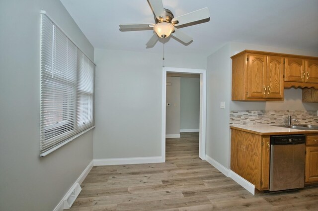 7410 162nd St, Tinley Park, IL 60477 - kitchen with dishwasher, light countertops, a ceiling fan, light wood finished floors, and baseboards