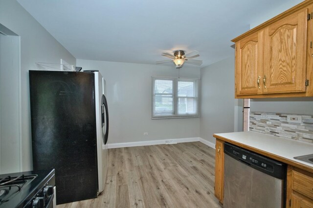 7410 162nd St, Tinley Park, IL 60477 - kitchen featuring stainless steel appliances, light wood-type flooring, ceiling fan, baseboards, and light countertops