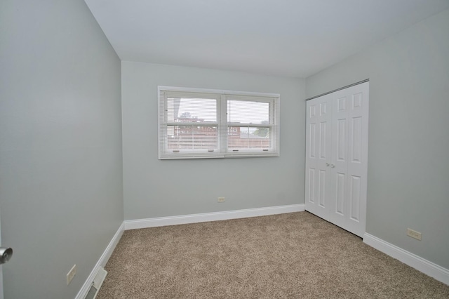 7410 162nd St, Tinley Park, IL 60477 - unfurnished bedroom with carpet, baseboards, and a closet