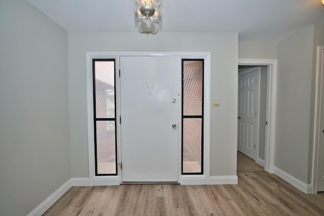 7410 162nd St, Tinley Park, IL 60477 - entryway featuring wood finished floors and baseboards