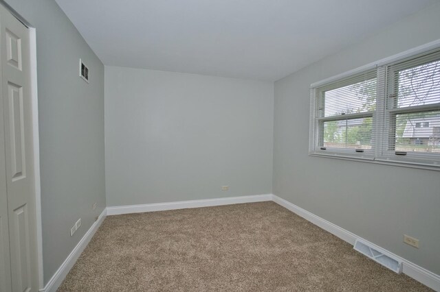 7410 162nd St, Tinley Park, IL 60477 - spare room featuring carpet flooring and baseboards