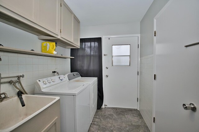 7410 162nd St, Tinley Park, IL 60477 - washroom with tile walls, cabinet space, and separate washer and dryer