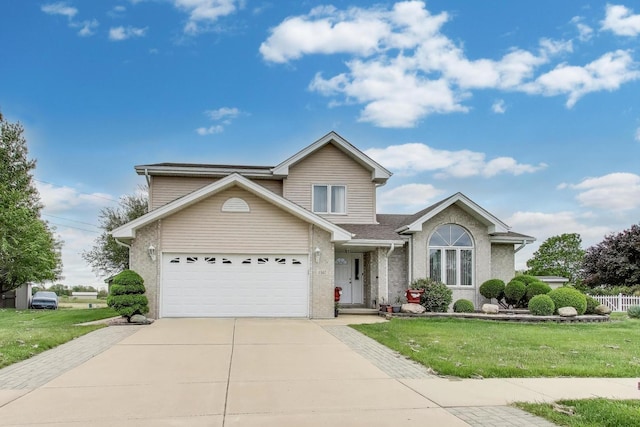 1347 Rainbow Cir, Manteno, IL 60950 - traditional home with concrete driveway, a garage, brick siding, and roof with shingles