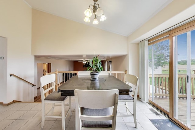 1347 Rainbow Cir, Manteno, IL 60950 - dining area featuring light tile patterned floors, a chandelier, baseboards, high vaulted ceiling, and ceiling fan