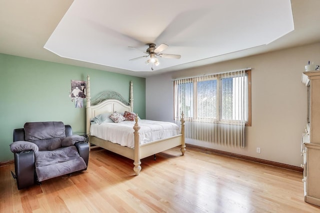 1347 Rainbow Cir, Manteno, IL 60950 - bedroom featuring light wood-style floors, a ceiling fan, and baseboards