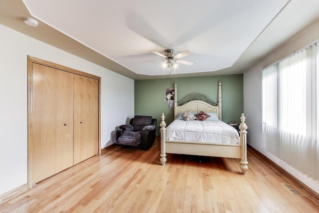 1347 Rainbow Cir, Manteno, IL 60950 - bedroom with wood finished floors, ceiling fan, a closet, and baseboards