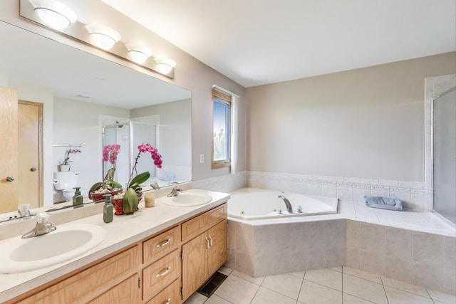 1347 Rainbow Cir, Manteno, IL 60950 - bathroom with a whirlpool tub, a stall shower, double vanity, tile patterned floors, and toilet
