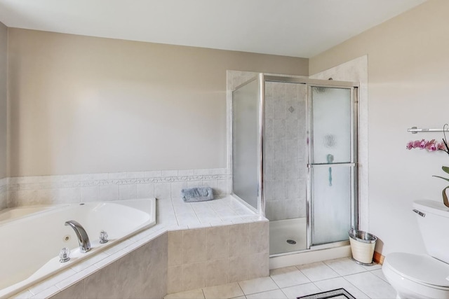 1347 Rainbow Cir, Manteno, IL 60950 - bathroom featuring a whirlpool tub, toilet, a shower stall, and tile patterned flooring