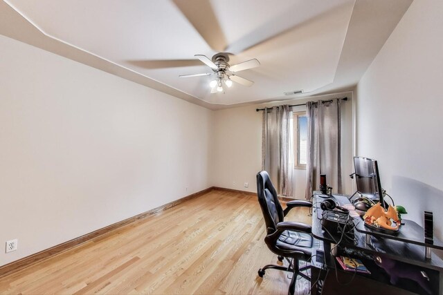 1347 Rainbow Cir, Manteno, IL 60950 - home office featuring ceiling fan, light wood-style flooring, and baseboards