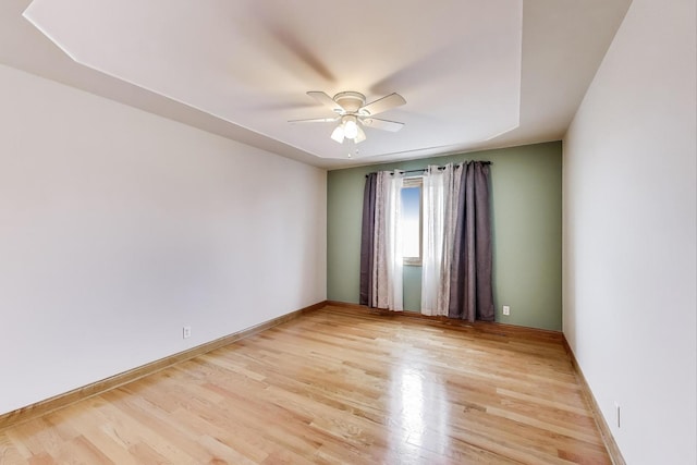 1347 Rainbow Cir, Manteno, IL 60950 - unfurnished room featuring a ceiling fan, light wood-style flooring, and baseboards