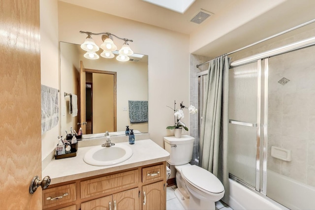 1347 Rainbow Cir, Manteno, IL 60950 - bathroom with toilet, vanity, and bath / shower combo with glass door