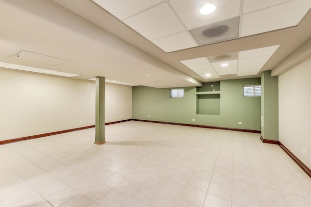1347 Rainbow Cir, Manteno, IL 60950 - basement with a paneled ceiling, baseboards, and healthy amount of natural light