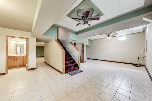 1347 Rainbow Cir, Manteno, IL 60950 - basement featuring a ceiling fan, baseboards, stairway, and light tile patterned floors