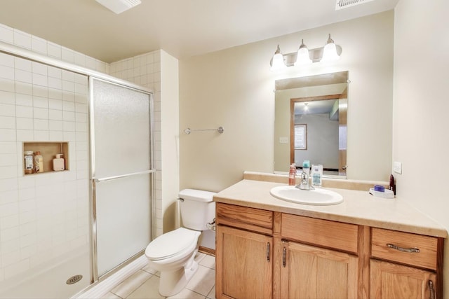 1347 Rainbow Cir, Manteno, IL 60950 - full bath featuring toilet, vanity, a shower stall, and tile patterned flooring