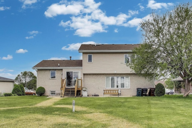 1347 Rainbow Cir, Manteno, IL 60950 - back of house with a lawn and brick siding