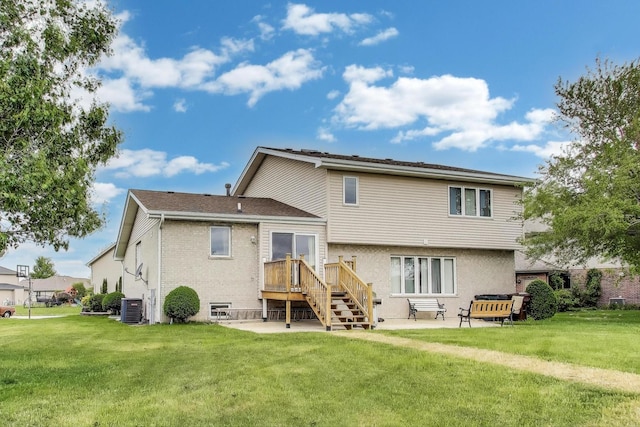 1347 Rainbow Cir, Manteno, IL 60950 - rear view of property with central AC, a patio area, and a yard