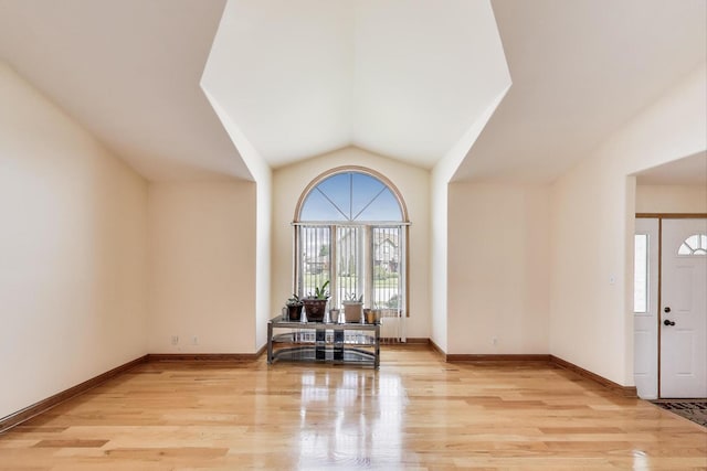 1347 Rainbow Cir, Manteno, IL 60950 - foyer with light wood-style floors, lofted ceiling, and baseboards