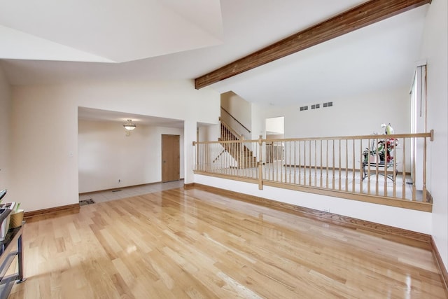 1347 Rainbow Cir, Manteno, IL 60950 - unfurnished living room featuring wood finished floors and baseboards