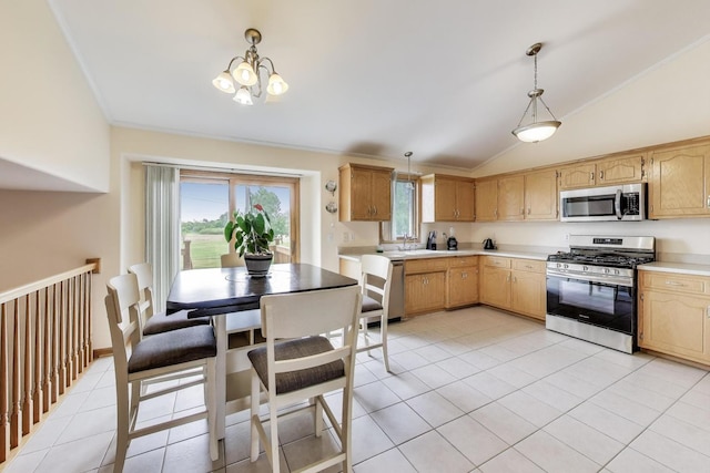 1347 Rainbow Cir, Manteno, IL 60950 - kitchen with appliances with stainless steel finishes, vaulted ceiling, light countertops, light tile patterned flooring, and a chandelier