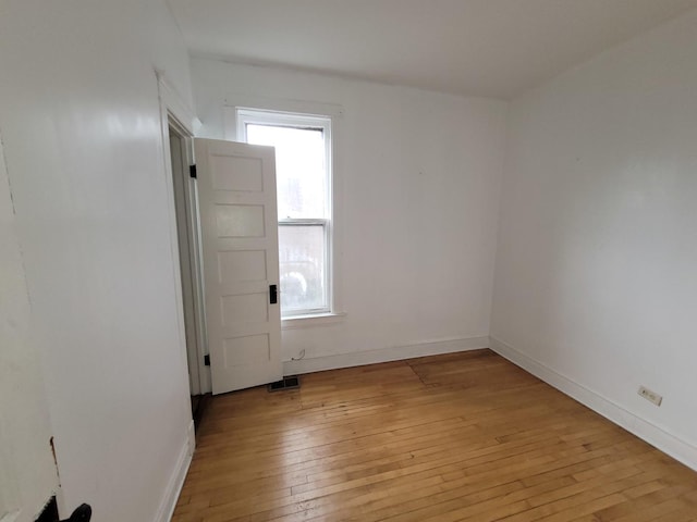 6801 S Oakley Ave, Chicago, IL 60636 - empty room featuring light wood finished floors and baseboards