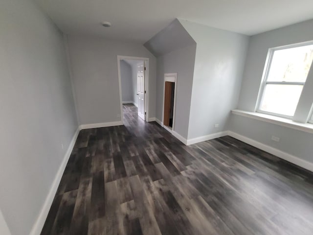 6801 S Oakley Ave, Chicago, IL 60636 - empty room featuring dark wood-type flooring and baseboards