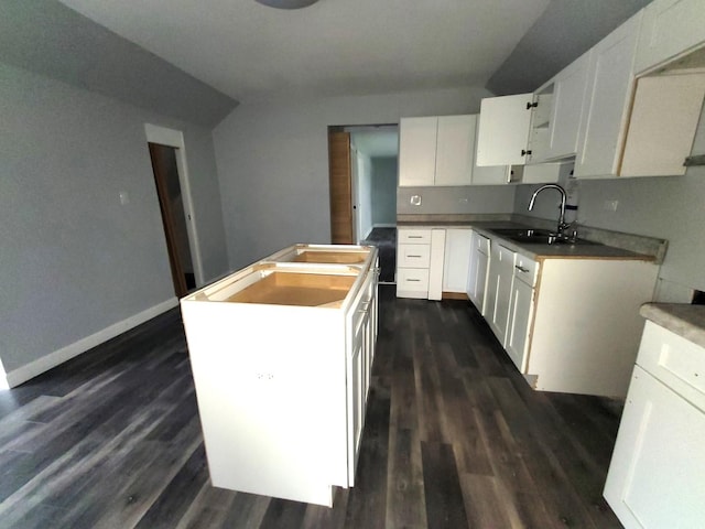6801 S Oakley Ave, Chicago, IL 60636 - kitchen with a sink, a center island, dark wood-type flooring, and baseboards