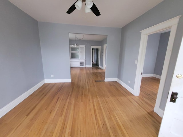 6801 S Oakley Ave, Chicago, IL 60636 - empty room featuring ceiling fan, light wood-style flooring, and baseboards