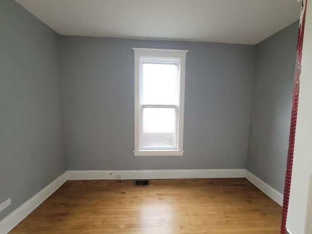6801 S Oakley Ave, Chicago, IL 60636 - empty room featuring wood finished floors and baseboards