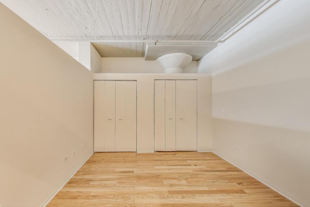 1525 S Sangamon St Unit 312, Chicago, IL 60608 - unfurnished bedroom featuring multiple closets and wood finished floors