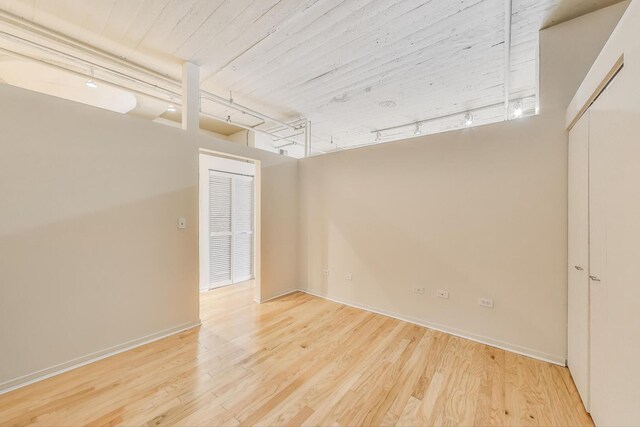 1525 S Sangamon St Unit 312, Chicago, IL 60608 - spare room with wood finished floors and baseboards