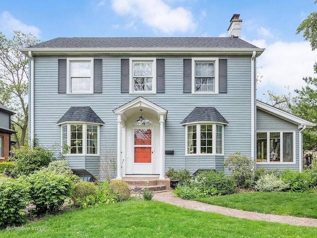 671 Euclid Ave, Glen Ellyn, IL 60137 - view of front of house featuring a chimney and a front yard
