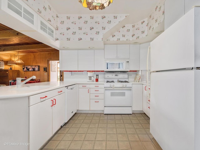 671 Euclid Ave, Glen Ellyn, IL 60137 - kitchen with white appliances, wood walls, a peninsula, wood ceiling, and light countertops