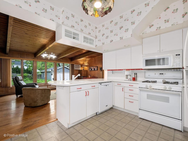671 Euclid Ave, Glen Ellyn, IL 60137 - kitchen featuring white appliances, open floor plan, a peninsula, light countertops, and a chandelier